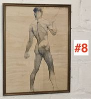 Full front view of the framed pencil sketch on wall with lot number visible