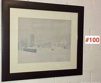 Frontal view of the framed serigraph print against a white wall showing full black frame with white mat border