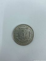 Reverse side of 1921 U.S. Morgan Silver Dollar showing eagle, inscriptions, denomination.