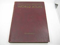 Front cover of the Encyclopaedia Britannica World Atlas book showing title and condition.