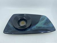 Front view of the ceramic ikebana flower arrangement set showing the rectangular base with the circular flower holder placed on top.