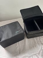 Black Case Logic CD storage case with lid closed, showing exterior and brand label