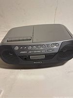 Front view of Sony CFD-S05 stereo showing speakers, control buttons, and cassette compartment.