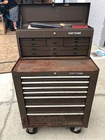 Front view of closed two-piece Craftsman tool chest and roller cabinet on casters