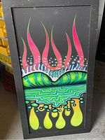 Full view of framed graffiti artwork in black wood frame, showing colorful abstract composition.