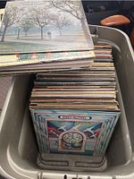 Bins full of approximately 90-100 vinyl records, various visible album covers including Barry McGuire and others