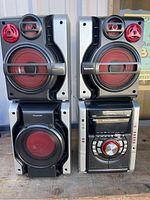 Front view of the stereo system with all four speakers and main unit.