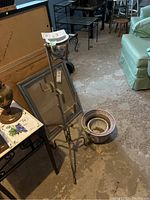 Metal plant stand with three round holders, 38 inches tall