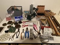 Overview of all lot contents on table including Steelpix machine, tools, frogs and accessories