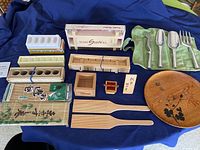 Full display of all sushi making kit components including molds, mats, utensils, paddles, and tray.