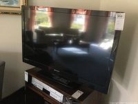 Front view of Emerson 39-inch LCD television with reflective widescreen.