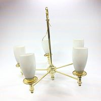 Chandelier with 5 brass arms and frosted glass shades, angled side view