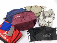 Lot overview showing six different bags grouped together on a white surface.