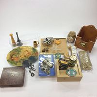 Full view of assorted home decor and lighting items including ceramics, candle holders, light bulbs, and more