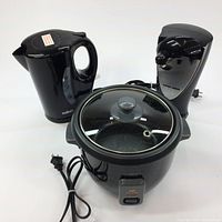 All three appliances together: rice cooker, electric kettle, and electric can opener