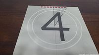 Front cover of Foreigner 4 vinyl record album showing large number 4 and Foreigner name.