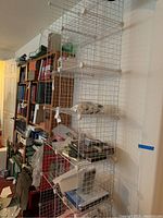 Full view of assembled wire shelving unit with multiple shelves and various items on it (contents not included).