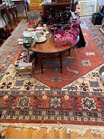 Full view of rectangular rug under a wooden table