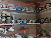 Shelf display of assorted cups and saucers