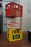 Stacked view of the three crates showing logos and condition