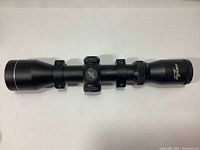 Full side profile view of the black matte Excalibur Twilight DLX crossbow scope mounted on rings.