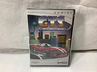 Front view of sealed jewel case with cover artwork showing a red racing car and city skyline with the title GTS Racing Challenge.