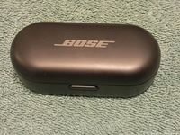 Closed charging case with Bose logo on top