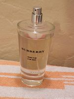 Front view of the Burberry Touch for Men bottle showing branding and liquid level