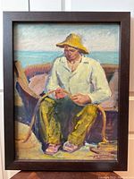 Full view of framed oil painting showing fisherman coiling rope