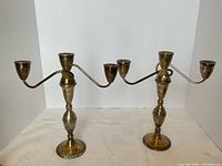 Front view of both candelabras side by side