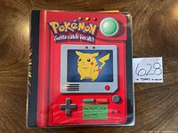 Front cover of binder showing Pokémon logo and Pikachu graphic