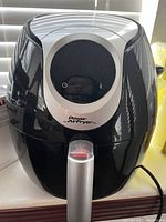 Front view of the black and silver Power Air Fryer XL with digital control panel and handle.