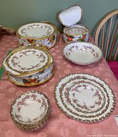 Assorted plates and padded carriers displayed on table