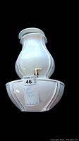 Front view of glazed ceramic lavabo hand basin wall sconce with spout and auction tag