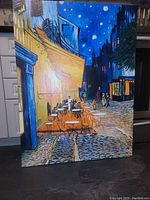 Front view of stretched canvas print leaning against cabinets