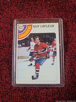 Front photo of the 1977-78 Guy Lafleur hockey card in protective casing showing player in Canadiens uniform on ice.