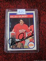 Front of Gilles Gilbert hockey card showing player image, team uniform, and autograph.