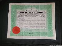 Front view of the Gold Syndicate Limited certificate showing the green decorative border, official black print text, and red embossed seal.