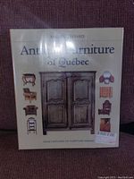 Front cover of the sealed book showing the title, author, and images of antique furniture.