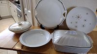 Front view of all items showing Mikasa platter, Royal China Starglow plate, Hanover Melody casserole, Royal Worcester covered casserole, and 2-quart white covered casserole
