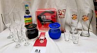Full view of the lot showing all glasses, drink loops, and the Houdini Lever Corkscrew set in red case without cutter tool