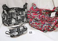 Photo showing all three items: one red paisley print bag, one black and white floral print bag, and matching wristlet, all laid out on a white background.