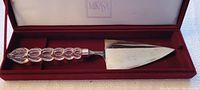 Mikasa cake server with clear bubble-like handle in red-lined box, metallic triangular blade.