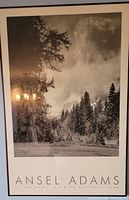 Close-up front view of the framed print showing the black and white photograph of El Capitan and the title text 'ANSEL ADAMS' and subtitle below.