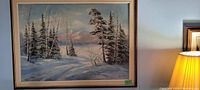Frontal photo of the entire oil painting showing winter landscape and wood frame