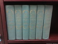 Six volumes of The Memoirs of Jacques Casanova in green cloth hardcover with gold embossed titles on spine.
