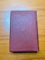 Front cover view of the 1889 hardcover book The Poetical Works of William Cowper with embossed design.