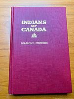 Front cover of the red hardcover book titled 'Indians of Canada' by Diamond Jenness with gold embossed lettering.
