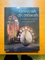 Front cover of the book showing title, authors, and cultural artifact illustrations.