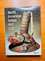 Front cover of the book showing an artistic Native American mask and the title North American Indian Art.
